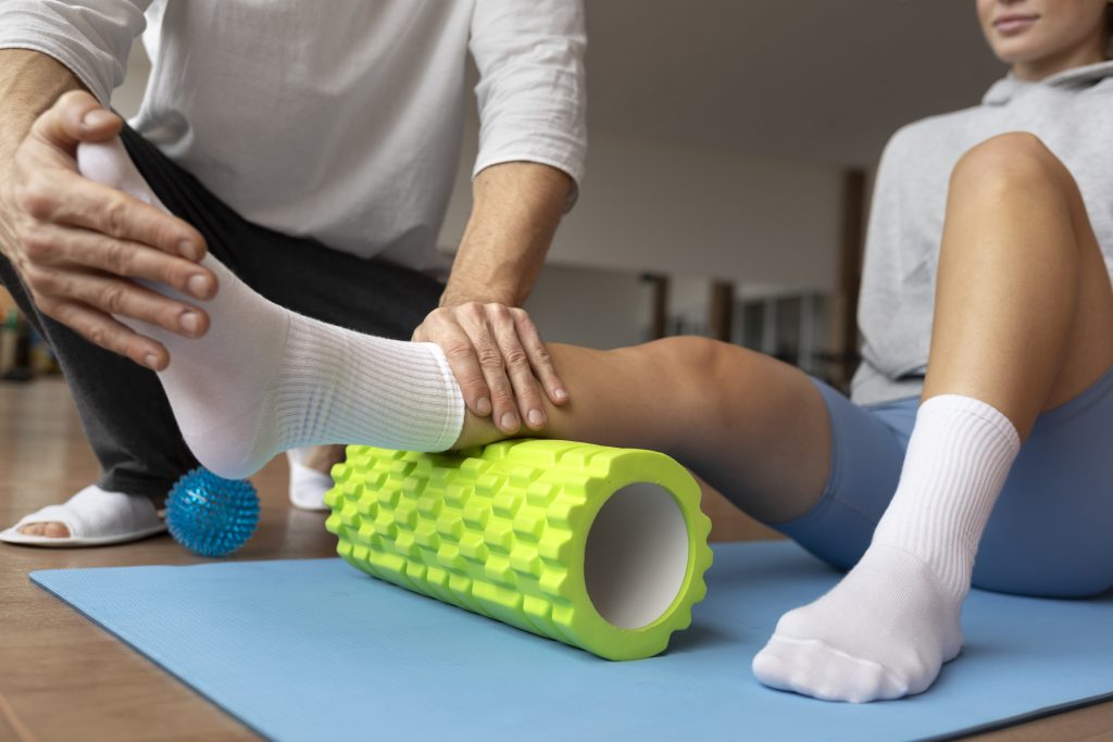 patient doing physical rehabilitation helped by therapists 1 KPM Physiotherapy